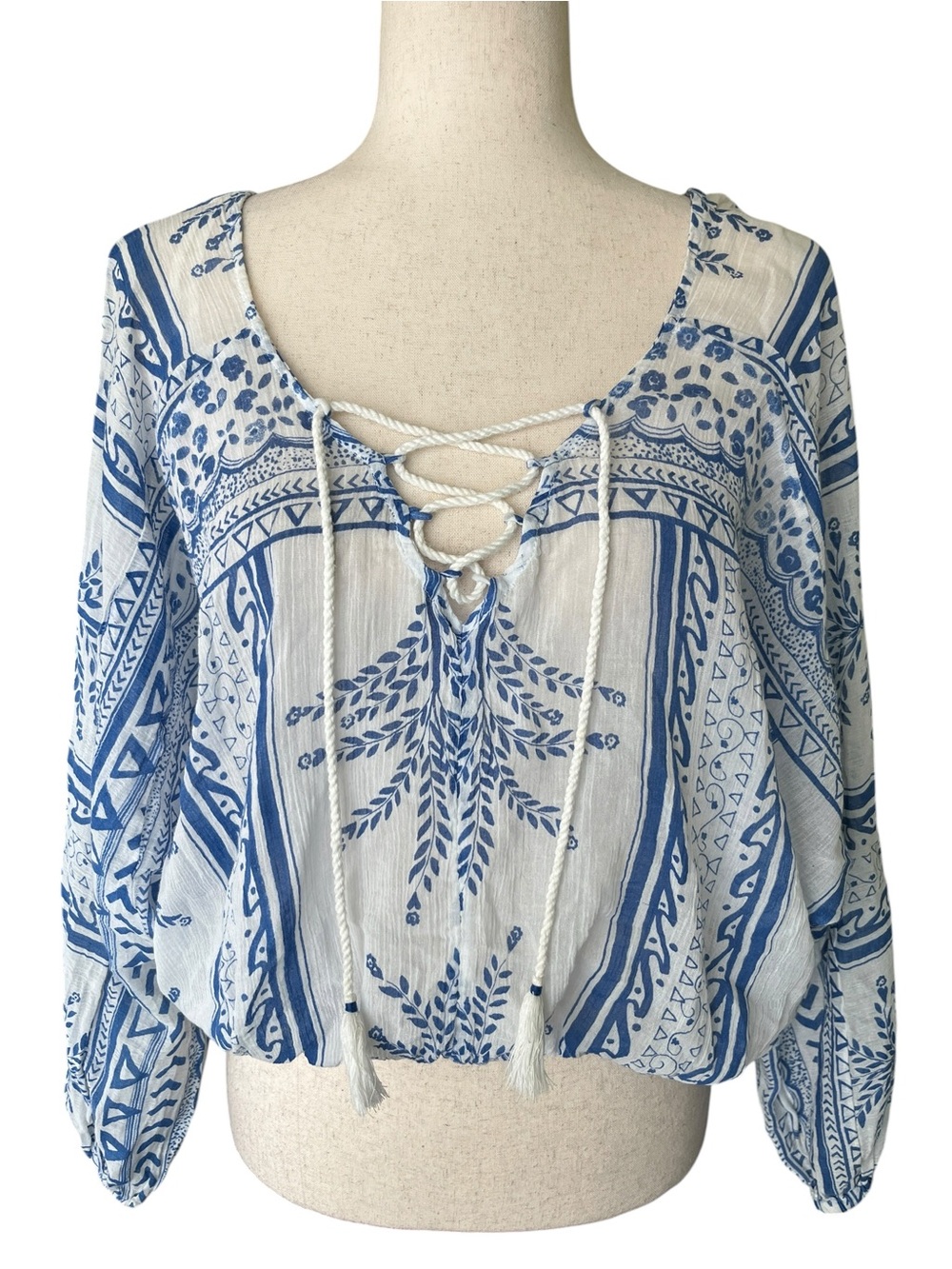 Free People boho top featuring a blue and white geo-paisley print